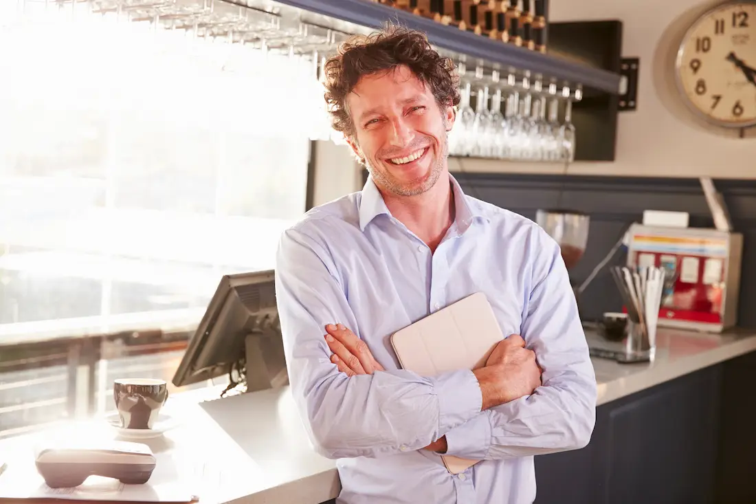 restaurant business owner smiling